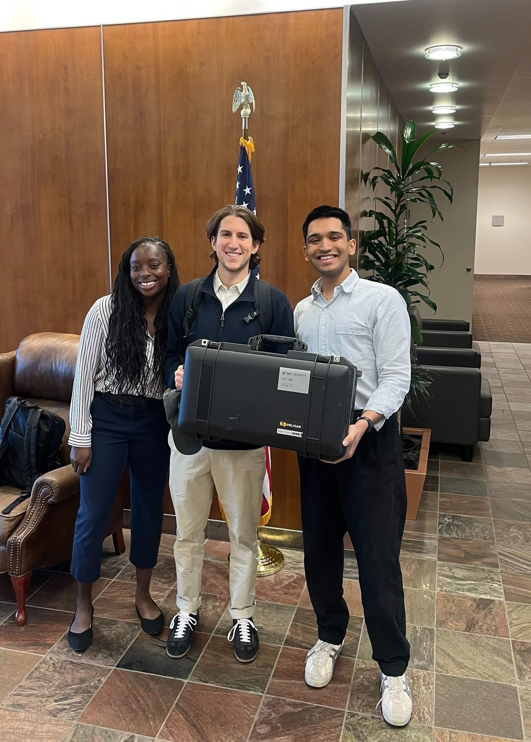 Three Method colleagues with an equipment case, from the company careers page